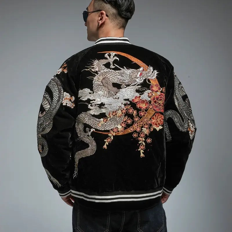 Black bomber jacket with detailed embroidered dragon and cherry blossoms in traditional Japanese style.